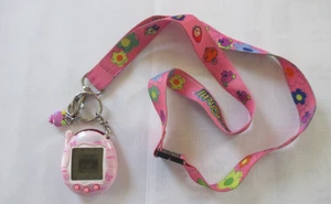 Vintage Tamagotchi Connection V1 2004 Pink with Ribbons, Includes Lanyard Works - Picture 1 of 7