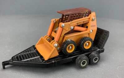 1:50 Ertl Diecast Case 1845C Uni-Loader Skid Steer & Trailer D1240 - Image 1 of 4