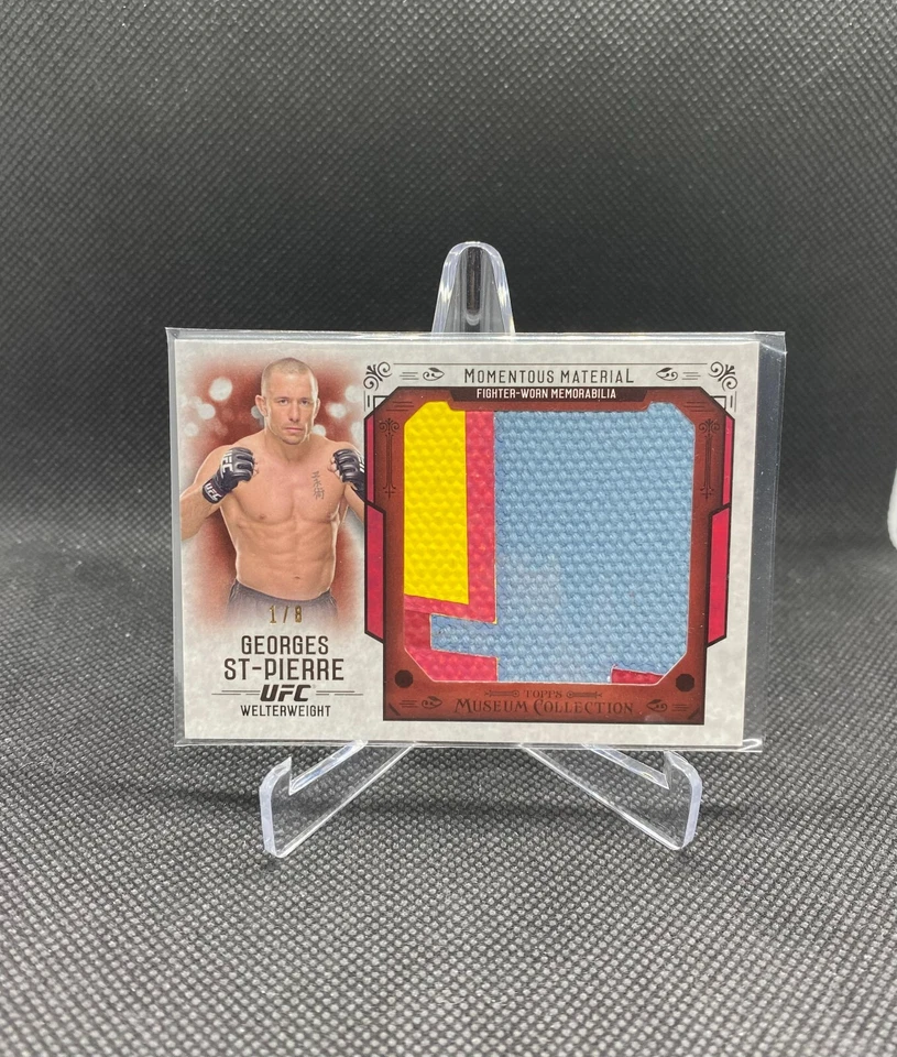 2015 Topps UFC Knockout Georges St-Pierre Momentous Material Relic Ruby Red #/8 - Image 1 of 2