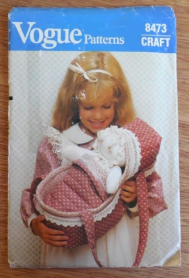 NEW/UNCUT Vintage Vogue Craft Pattern 8473  Doll with Carrier and Coverlet - Image 1 of 2