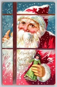 Raphael Tuck & Son Santa mirando a través de la ventana muñeca sosteniendo, postal de Navidad - Imagen 1 de 2