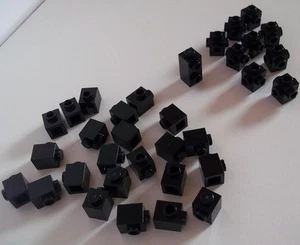 LEGO Black 1x1 bricks with side studs - 87087, 32952, 4733 - Picture 1 of 2
