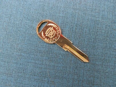 CADILLAC CREST GOLD ALLANTE ORIGINAL NOS DOOR TRUNK KEY BLANK 1987 - 1993 - Image 1 of 2