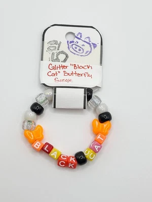 Pulsera Kandi individual mariposa naranja "Gato negro" blanco y negro Foto 1 de 4