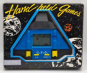 UFO LCD HANDHEALD ELECTRONIC GAME WATCH VINTAGE 80 NEW IN BOX - Foto 1 di 15
