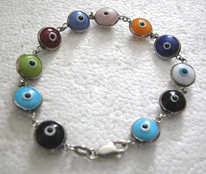 UNA HERMOSA PULSERA HECHA A MANO PLATA ESTERLINA Y VIDRIO MAL OJO DE 11 ESLABONES - Imagen 1 de 3