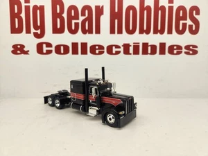 1/64 DCP Black W/Red/Silver Graphics 389 Peterbilt 63" Flattop Sleeper Tractor - Picture 1 of 11