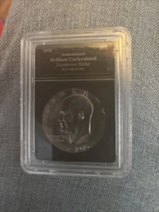 1976 Authenticated Brilliant Uncirculated Eisenhower Dollar Coin BA17-00040_007 - Picture 1 of 4