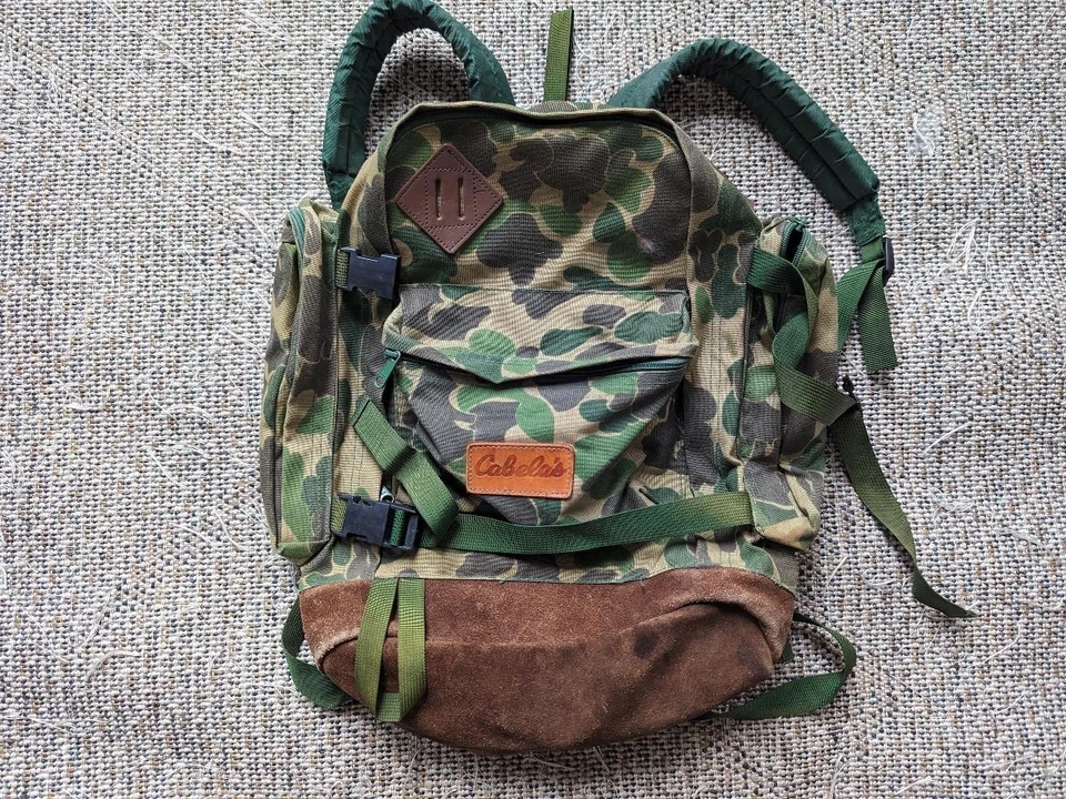 Mochila vintage CABELAS PIEL DE RANA lona BOLSO CUERO camuflaje jansport años 90 Foto 1 de 4