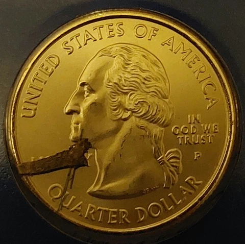 2007 Idaho Quarter Struck Through With A Piece Of Wire Cover
