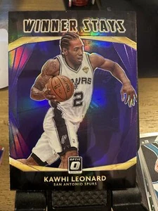 2020-21 Donruss Optic #6 Kawhi Leonard Winner rimane viola - Foto 1 di 2