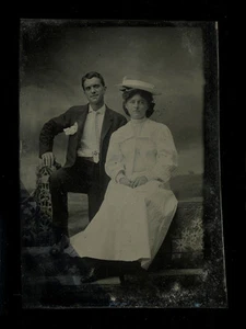 1880s Tintype Couple with Cocky Gent Pose and Demure Woman in White, 3 3/8" - Picture 1 of 1