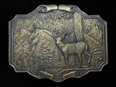 QE09109 HEBILLA DE CINTURÓN VINTAGE 1974 **CIERVOS EN EL BOSQUE** ARTE CONMEMORATIVO LATÓN Foto 1 de 2
