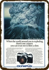 1980 OLYMPUS OM-1 CAMERA & MT. ST. HELENS ERUPTS Vintage Look DECORATIVE METAL S - Picture 1 of 1