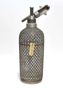 VINTAGE 1925 SELTZER BOTTLE CO2 WITH METAL MESH NETTING - Picture 1 of 12