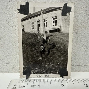 Vintage Snapshot Photo US Military Soldier Silly Goofy Pose Feet in Air WWII - Picture 1 of 3