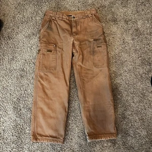 Pantalones de trabajo Duluth Trading de lona tostada carga utilitaria forrados de vellón 36x32 relajados - Imagen 1 de 12