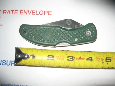 CUCHILLO DE BLOQUEO HOJA ÚNICA CON HOJA DENTADA Foto 1 de 3