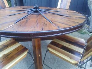 Rustic wagon wheel 2 tables and 10 chairs