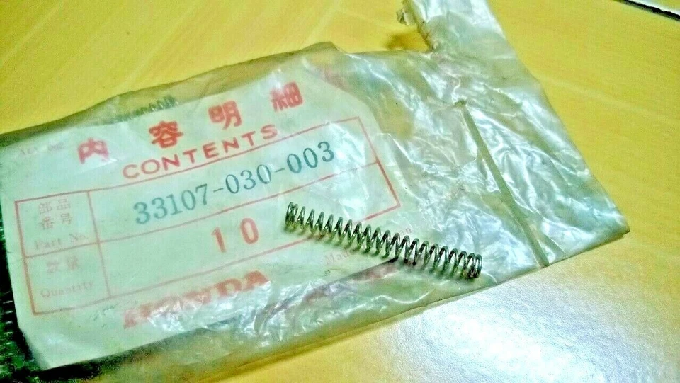 Muelle de ajuste de faros Honda C50 C65 C70 C90 CB160 CL70 CL90 CT70 CT90 S90 NUEVO EN STOCK Foto 1 de 1