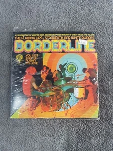 THE FLAMING LIPS / THE BLACK KEYS - Split 7" LIMITED VINYL - Imagen 1 de 2