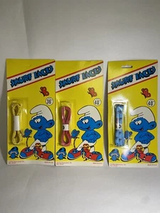 Lot of 3 1982 Smurfs Pair of RED YELLOW BLUE Shoe Laces With Display Card - Picture 1 of 3