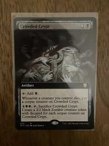 MTG - Crowded Crypt. Innistrad: Commander. Selten - Extended Art Black Artifact. - Bild 1 von 1