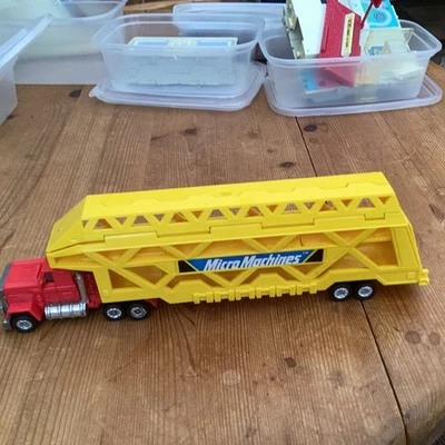 MICRO MACHINES YELLOW CAR TRANSPORTER CAR STORAGE 1998 GALOOB   - Image 1 of 4