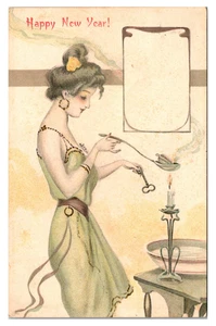 HAPPY NEW YEAR - ART NOUVEAU - WOMAN HEATS OVER CANDLE - 1908 HOLIDAY POSTCARD - Picture 1 of 2