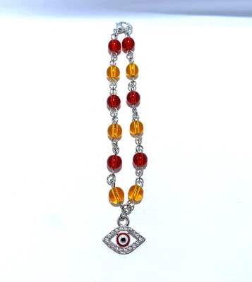 Pulsera con dije de mal de ojo de cristal rojo y naranja Foto 1 de 2