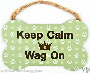 Letrero interior en forma de hueso para perros con mango de cuerda - "Mantén la calma y mueva" - Imagen 1 de 1