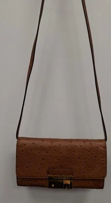 Bolso sin asas Michael Kors para mujer de cuero naranja talla mediana en relieve Foto 1 de 4