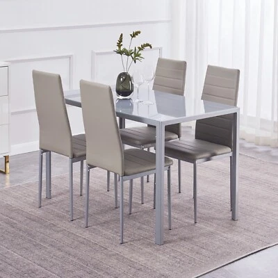 Mesa de comedor de vidrio templado gris 47" y juego de 4 sillas de comedor de cuero sintético gris Foto 1 de 4