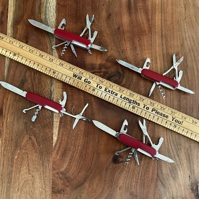 Lot of 4 VICTORINOX Swiss Army Knife Multi Tool RED - Image 1 of 4