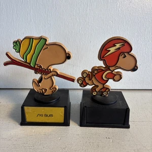 2 Vtg Snoopy Trophy 1958 Aviva Plastic ski bum, and rollerblader missing Plaque - Picture 1 of 7