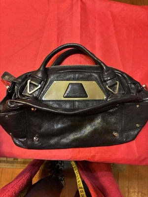 Bolso Kenneth Cole Reaction de cuero negro con asa superior placa dorada nuevo sin etiquetas Foto 1 de 4