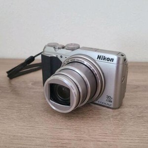 Nikon Coolpix S9900 Silver Digital Camera Good