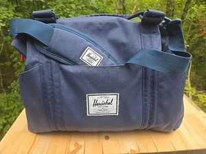 The Herschel Supply Strand Sprout Diaper Bag Blue With Red And White Pockets  - Picture 1 of 13