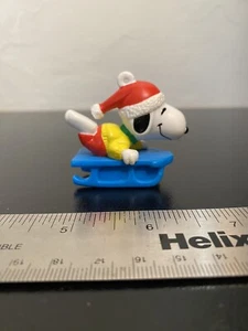 Vintage Peanuts Sledding Snoopy United Feature Syndicate Inc PVC Ornament - Picture 1 of 5