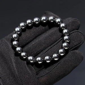 Brazalete elástico curativo hecho a mano con cuentas de piedras preciosas redondas de hematita negra de 8 mm 6-8" - Imagen 1 de 8