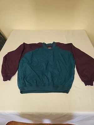 Chaqueta de golf Sun Mountain Headwind grande de nailon. Verde y púrpura. La Quinta Sport Foto 1 de 4