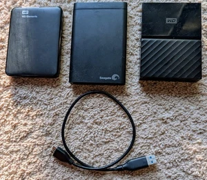 3 untested HDDs WD Elements 1TB & My Passport 4TB + Backup Plus Seagate 1TB - Picture 1 of 2