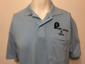 Vintage 1980s Pacific Film Video Employee Work Polo Shirt L Powder Blue 50/50 - Picture 1 of 6