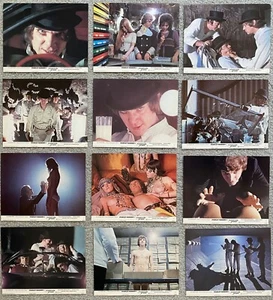 POSTER FILM ORIGINALE ARANCIONE OROLOGIO COLORE ANCORA SET DI 12 8"" X 10"" 1972 UK - Foto 1 di 1
