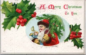 Original Christmas Embossed Postcard- Santa Holding Tree and Toys - Holly - Picture 1 of 2