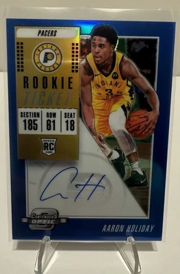 2018-19 Contenders Optic Aaron Holiday Rookie Ticket Autograph Blue RC /49 - Image 1 of 2