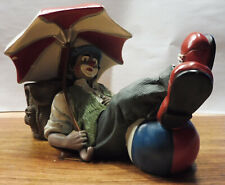 Gilde Clown Liegend mit Ball und Sonnenschirm ( Defekt )
