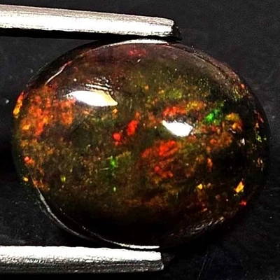 NATURAL AAA+ GENUINE COLOR PLAY OVAL CABOCHAN  ETHIOPIAN WELO BLACK OPAL 1.70CTS - Image 1 of 3