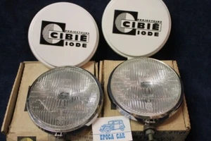 CIBIE FENDINEBBIA COPPIA TRASPARENTE CUFFIE METALLO FOG LAMP NOS - Imagen 1 de 3