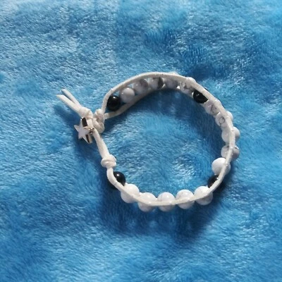 White turquoise with black onyx, leather-wrapped beaded bracelet. - Image 1 of 2